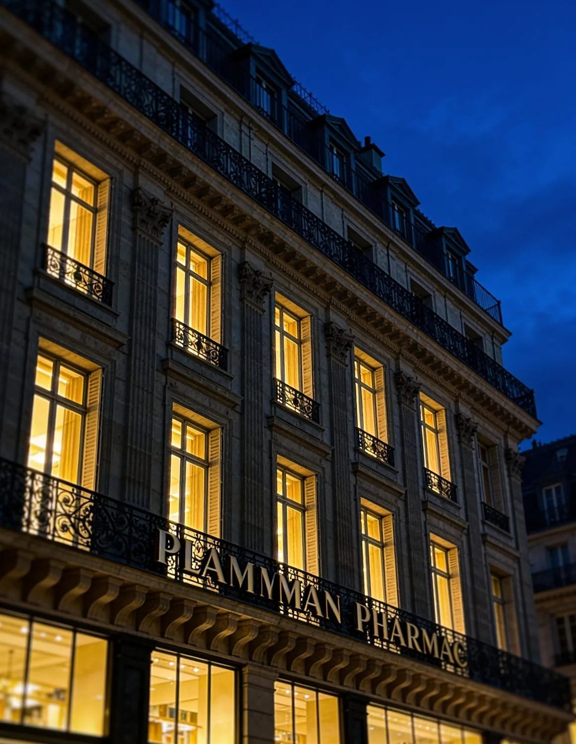 Parisian pharmacy facade at blue hour